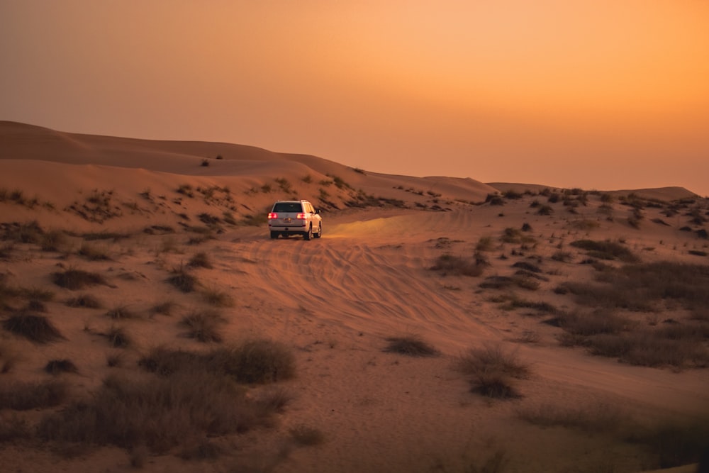 Heavy vehicle on a mining road at sunset