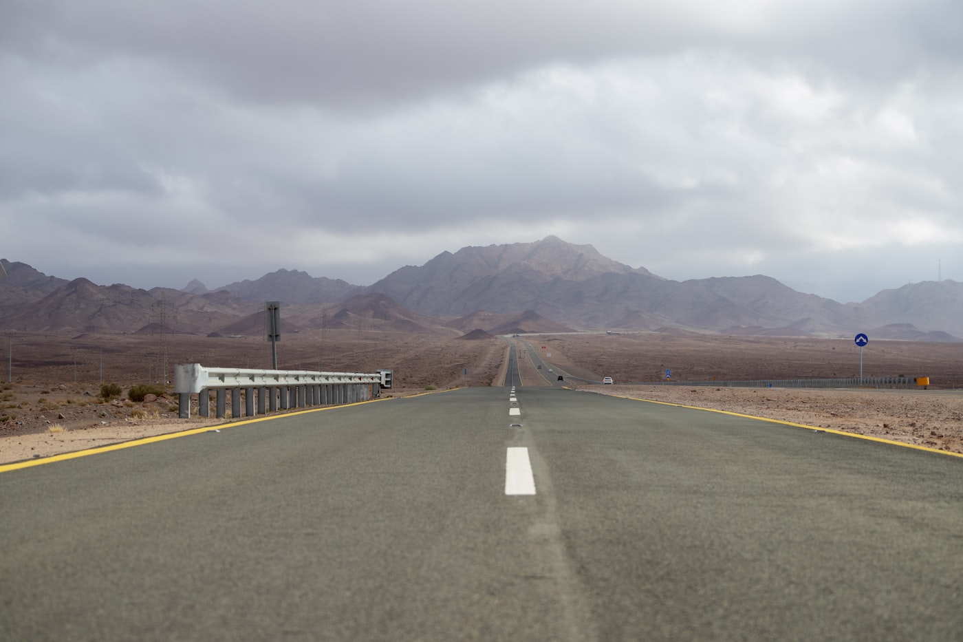 Stabilized highway running through arid landscape